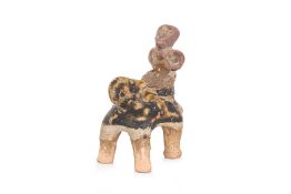 A SMALL THAI STONEWARE MODEL OF AN ELEPHANT AND RIDER