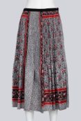 COMME DES GARCONS TRICOT - A 2016 GEOMETRIC RED, WHITE AND BLACK FLORAL PRINT PLEATED SKIRT