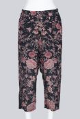 BY WALID - A PAIR OF BLACK AND PEACH FLORAL PRINT DROP CROTCH GAUCHOS