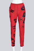 COMME DES GARCONS - A PAIR OF 2000 RED AND BLACK GRAPHIC PRINT PANTS