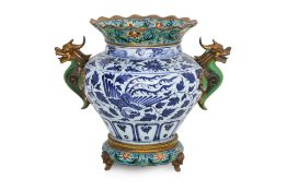 A LARGE CLOISONNE ENAMEL MOUNTED BLUE AND WHITE PORCELAIN JAR
