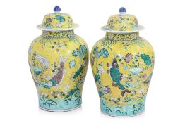 A PAIR OF FAMILLE JAUNE PORCELAIN JARS AND COVERS