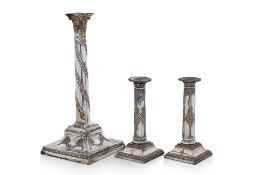 THREE ENGLISH SILVER PLATED CANDLESTICKS