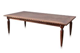 A LARGE INDONESIAN TEAK DINING TABLE