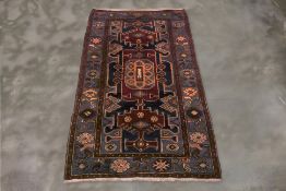 A HAMADAN WOOL RUG