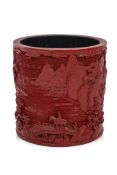 A VERY LARGE CHINESE CARVED RED LACQUER BRUSH POT