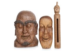 A GROUP OF THREE CARVED WOOD HEADS