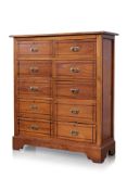 A TEAK CHEST OF TEN DRAWERS