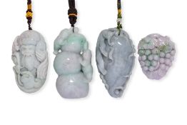 A GROUP OF FOUR JADE PENDANTS