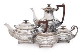 AN ENGLISH SILVER PLATED FOUR PIECE TEA SERVICE BY ELLIS-BARKER