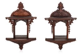 A PAIR OF CARVED ROSEWOOD MIRRORS