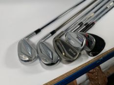 Six assorted golf clubs including Taylor Made, Mizuno and more. Preowned
