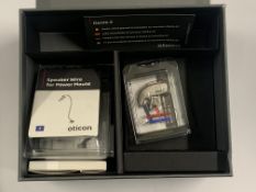 An Oticon Real 2 Minirite R C090 with Accessories. As New.