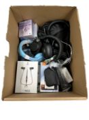 Assorted new & pre-owned headphones.