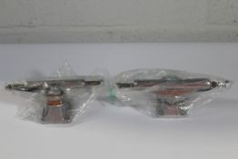 Two Stage 11 skateboard trucks to include 109 polished T hanger and 139 polished mid trucks.