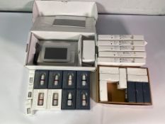 Amiea Next control unit with five boxes of various needles and twenty various pigment colours.