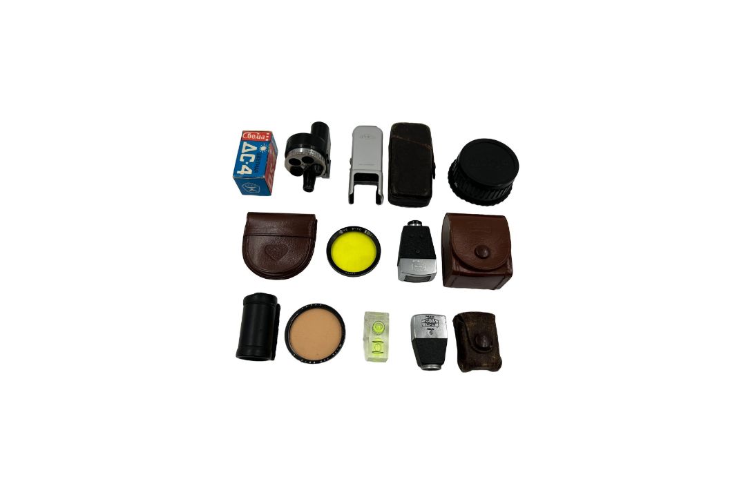 Assorted vintage camera accessories.