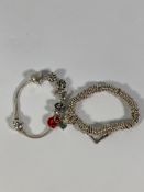 Two Pandora charm bracelets and seven charms, one charm is personalized.