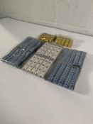 A pallet of assorted tailors tape measures.