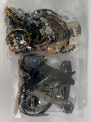 A bag of costume jewellery and a bag of assorted watches.
