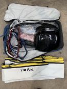 A Trak 2.0 Foldable Portable Kayak in Light Blue and Yellow, Comes in a Trak 2.0 Rolling Travel Bag.