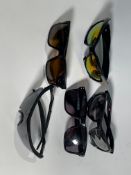 Five pairs of Oakley sunglasses.