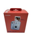 As new Fujifilm Instax Mini 12 Instant Camera in Pastel Blue (EAN: 4547410489064).