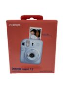 As new Fujifilm Instax Mini 12 Instant Camera in Pastel Blue (EAN: 4547410489064).