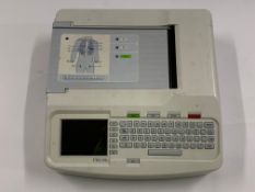 A Mortara Eli 150c Series 2 Electrocardiograph with no cables. Preowned. (Crack on top right keyboar