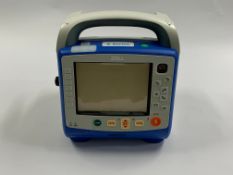 ZOLL X Series Monitor Defibrillator Base Unit with manual. (Light cosmetic damage, no ca