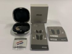 An Oticon Engage BTE Hearing and White Case.