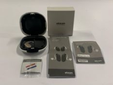 An Oticon Engage BTE Hearing and White Case.