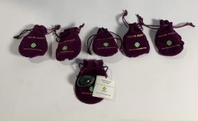 Six Nephrite Jade Yoni Eggs in Purple Velvet Pouches And With Certificates of Authenticity.