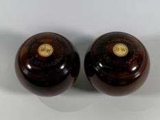 A pair of Wooden Lawn Bowls. Preowned