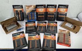 A box of assorted batteries to include Duracell an
