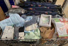 A large basket of assorted new clothing and relate