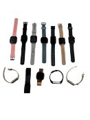 Assorted pre-owned Smartwatches/Fitness Trackers including Fitbit, Woop & Aukey (Untested, sold as