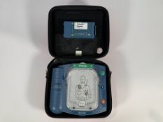 Pre-owned Philips Heartstart HS1 Defibrillator with Carry Case and Battery.