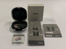 An Oticon Engage BTE Hearing and White Case.