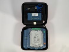 Pre-owned Philips Heartstart HS1 Defibrillator with Carry Case and Battery.