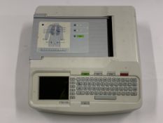 A Mortara Eli 150c Series 2 Electrocardiograph with no cables. Preowned. (Crack on top right keyboar