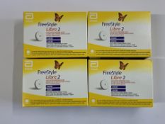 Four FreeStyle Libre 2 Flash Glucose Monitoring Systems (EXP: 2025-12-31). As New.
