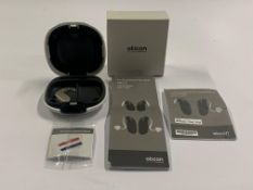 An Oticon Engage BTE Hearing and White Case.