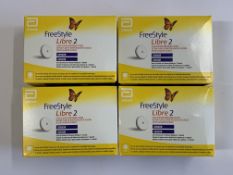 Four as new FreeStyle Libre 2 Flash Glucose Monitoring Systems (EXP: 2026-01-31).