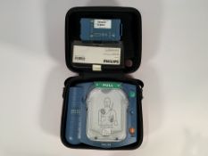 Pre-owned Philips Heartstart HS1 Defibrillator with Carry Case and Battery.