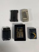 Five pre-owned lighters to include Zippo and JT Dupont (over 18s only).