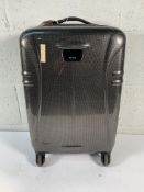 Pre-owned Tumi hard shell wheeled suitcase.