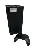 Pre-owned Microsoft Xbox Series X 1TB Console with controller.
