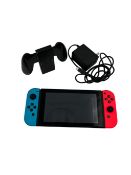 Pre-owned Nintendo Switch (HAC-001-01) with Joy-Con Grip & US charger.
