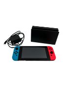 Pre-owned Nintendo Switch (HAC-001) with dock & US charger.